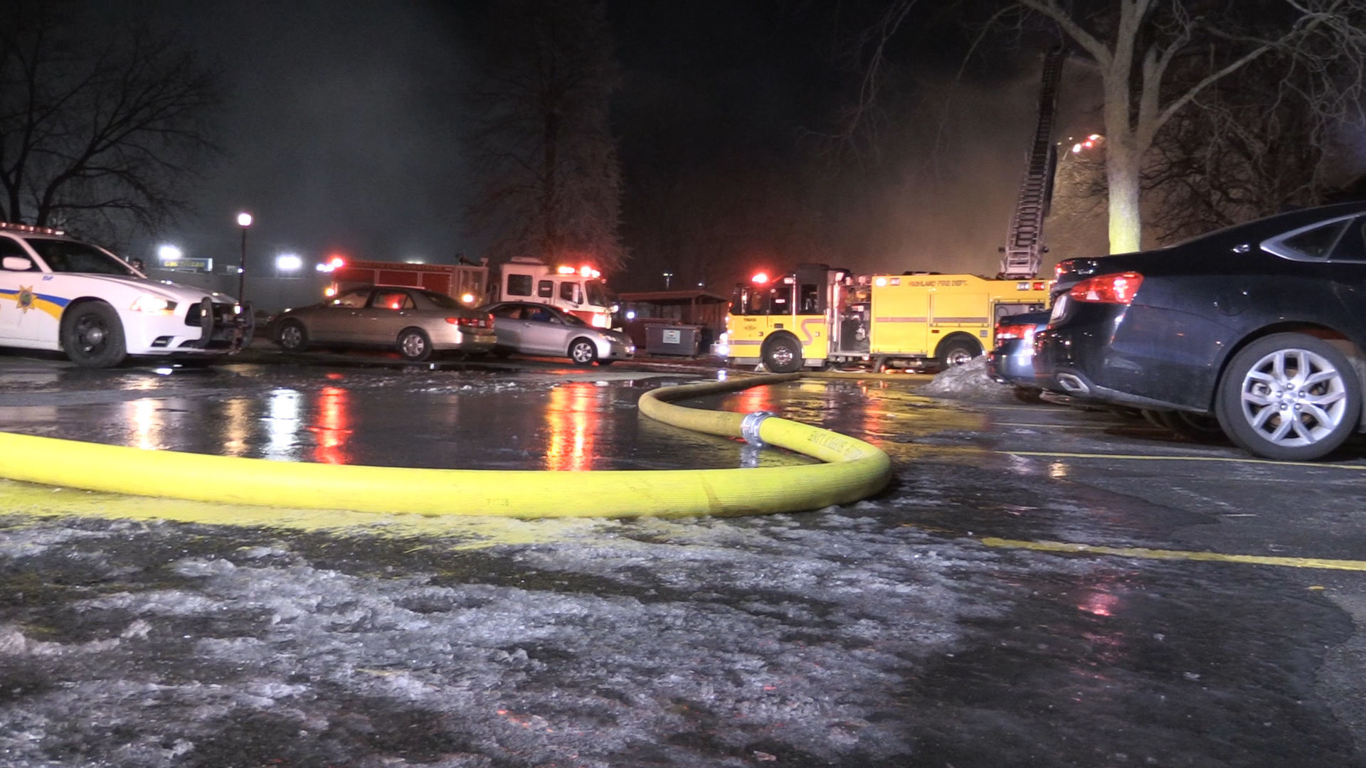 Firefighters continue to battle apartment building fire